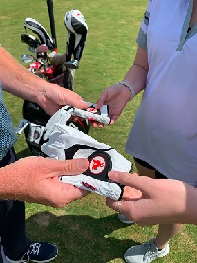 Brad Fritsch with junior golfers on a golf course